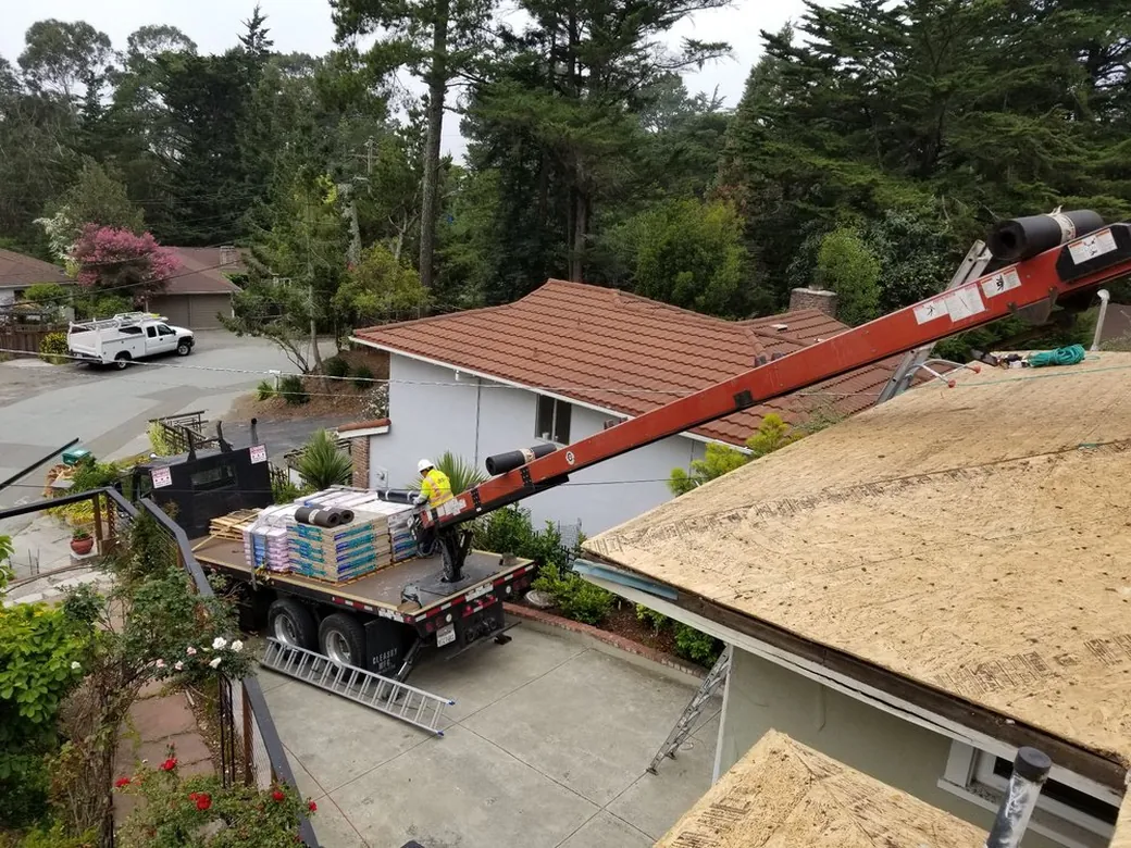 Franco Roofing truck and ladder lift set up outside a Bay Area home