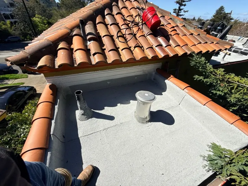 Terracotta tile ridge and flashing on a finished Bay Area roof