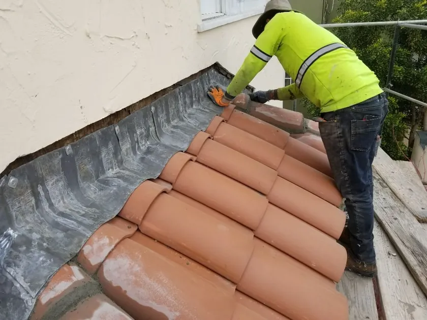 Architectural shingles being installed on a roof plane