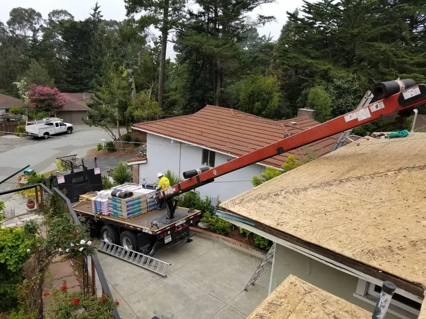 Roofing materials delivered and staged at a job site