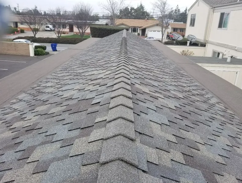 New architectural shingles running up to a finished ridge cap